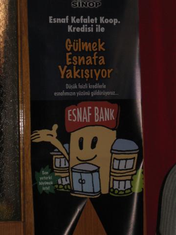 "Gülmek Esnafa Yakışıyor" yazılı esnaf kefalet kredisi afişi
